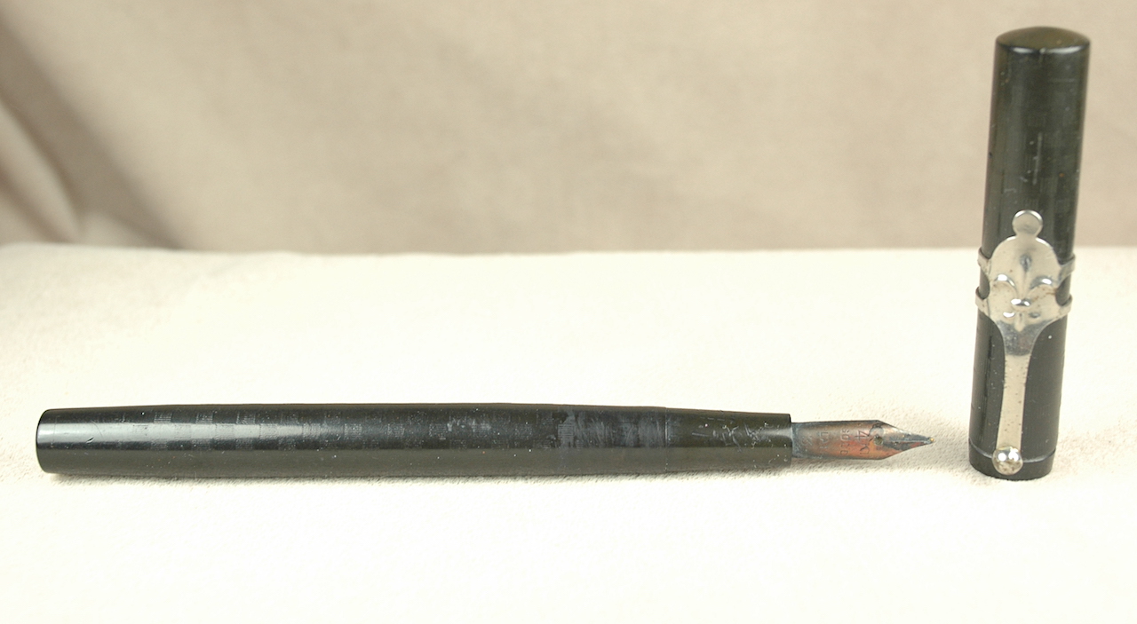 A Montegrappa roller ball pen in orange, together with a Louis