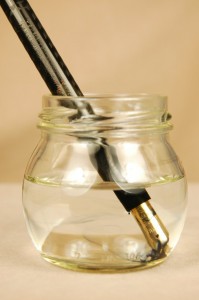 A Waterman's #15 eyedropper soaks in water to help loosen the old ink sealing its threads.